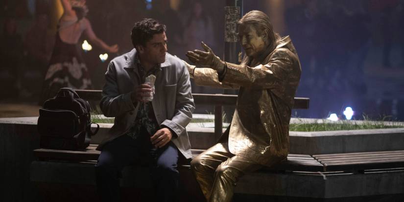 Steven eating lunch next to Crawley the living statue in London