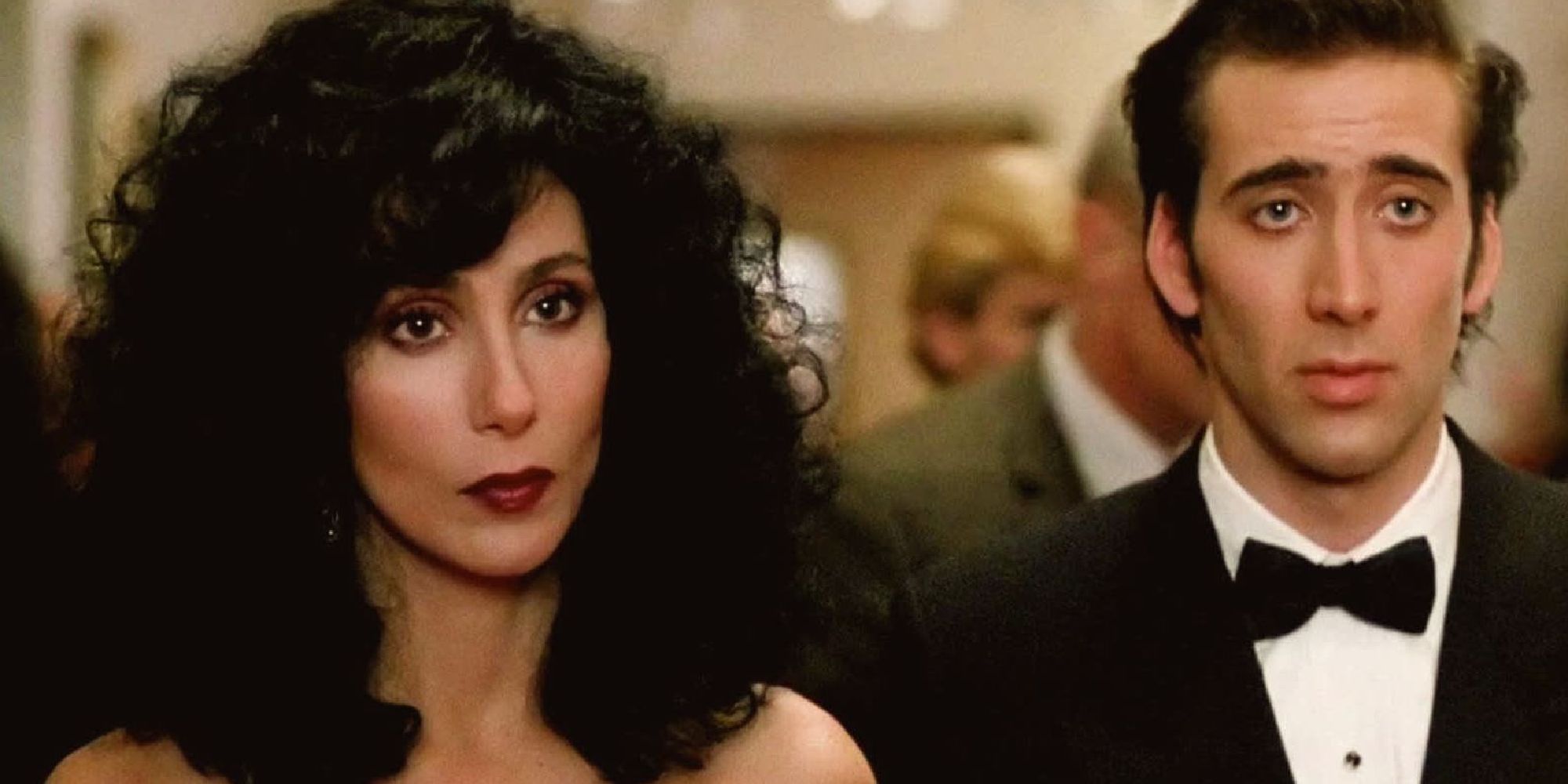 Cher and Nicholas Cage standing next to each other in Moonstruck