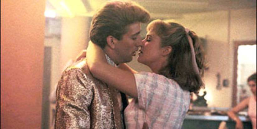 Nicholas Cage and Kathleen Turner about to kiss in Peggy Sue Got Married