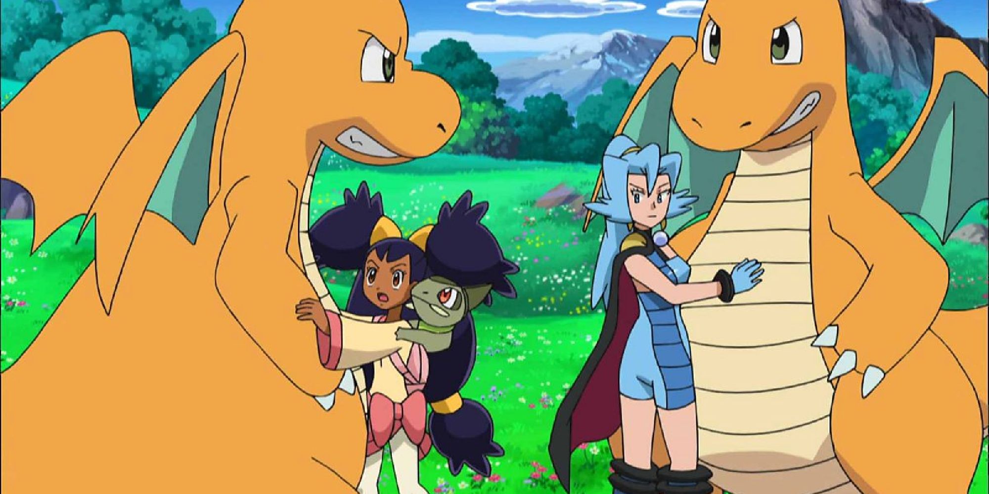 Iris and Axew calming down her Dragonite as it feuds with Clair's Dragonite