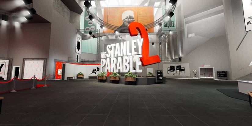 an exhibition room with a large sign in the middle that reads "The Stanley Parable 2." there are velvet ropes to the left and doorways leading to other exhibits on the right. Over the sign is a circular rig of spotlights 