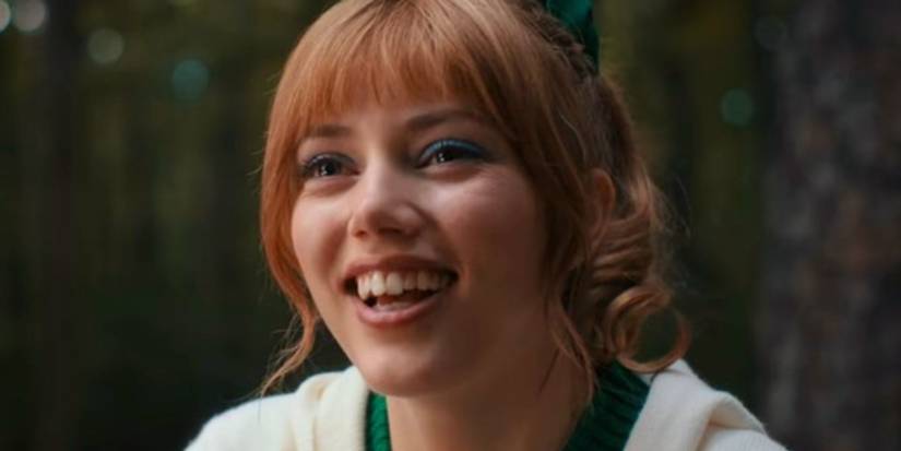 Chrissy (Grace Van Dien) smiling in her cheerleading uniform in Stranger Things