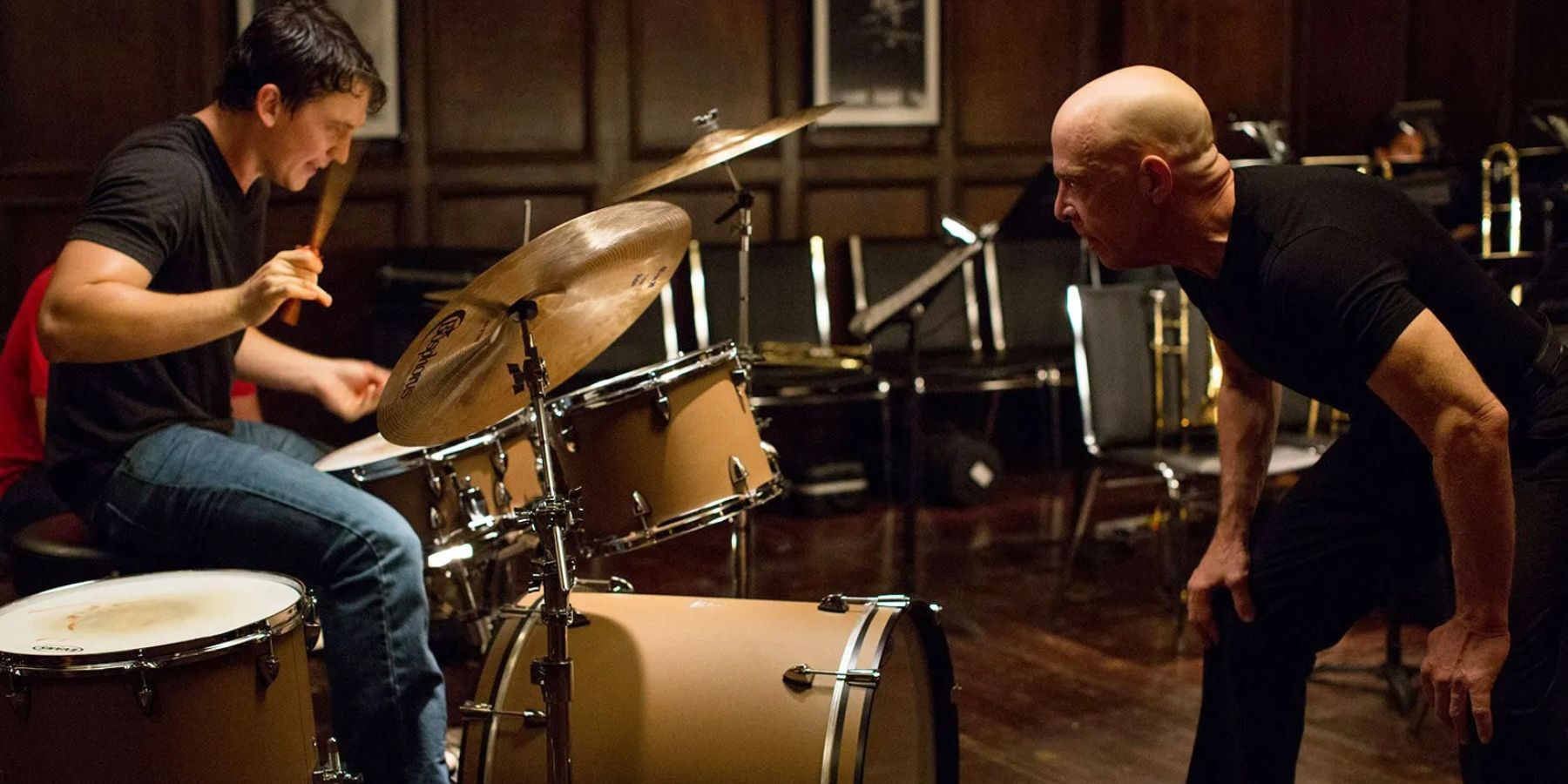 Andrew (Miles Teller) playing the drums with Fletcher (J.K. Simmons) yelling in Whiplash