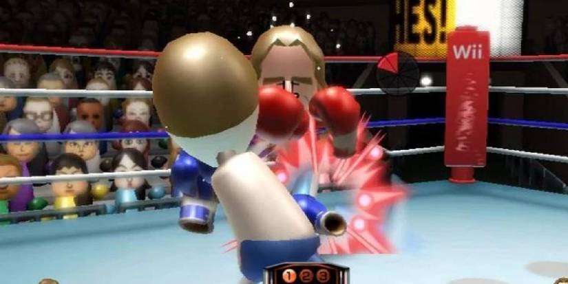 Two Miis boxing in Wii Sports surrounded by an audience of Miis