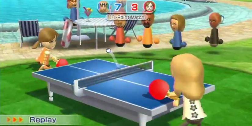 Two Miis playing table tennis near a pool with Mii spectators in Wii Sports Resort