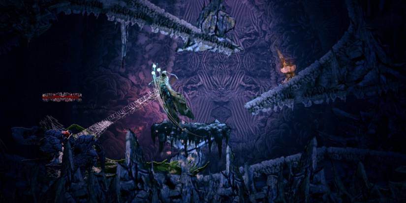 battling a spider like web monster in a cave in source of madness