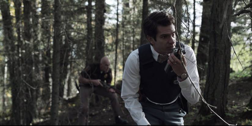 Detective Jeb Pyre walkies to his officers