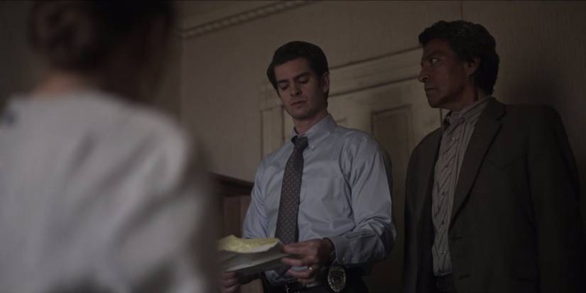 Detectives Pyre (Andrew Garfield) and Taba (Gil Birmingham) discover list of names in Under the Banner of Heaven