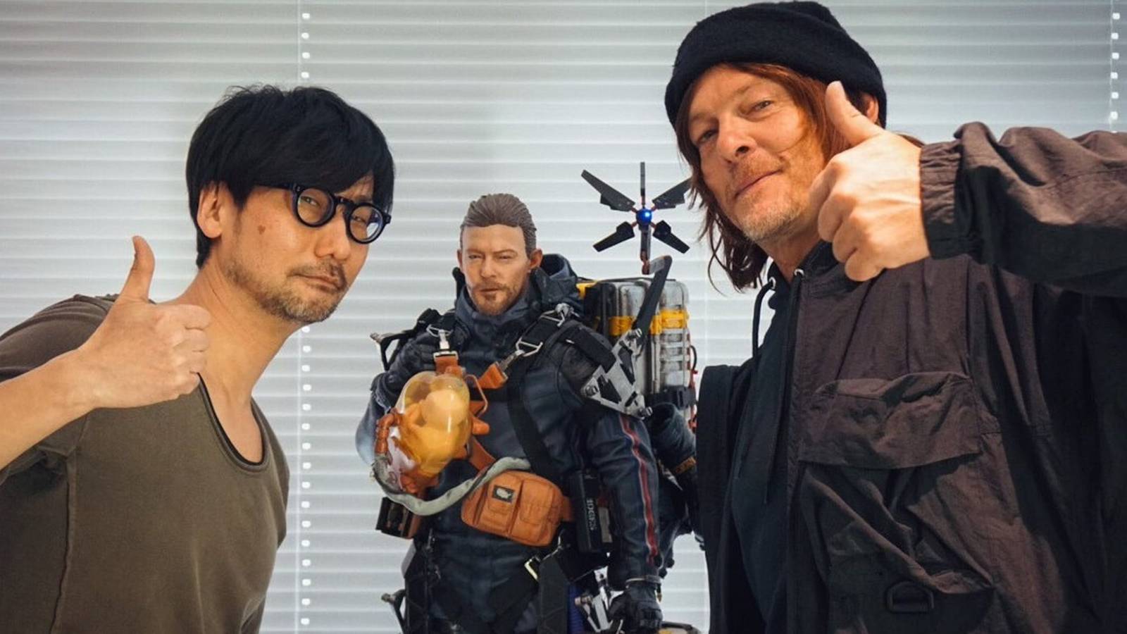reedus and kojima with a sam statue