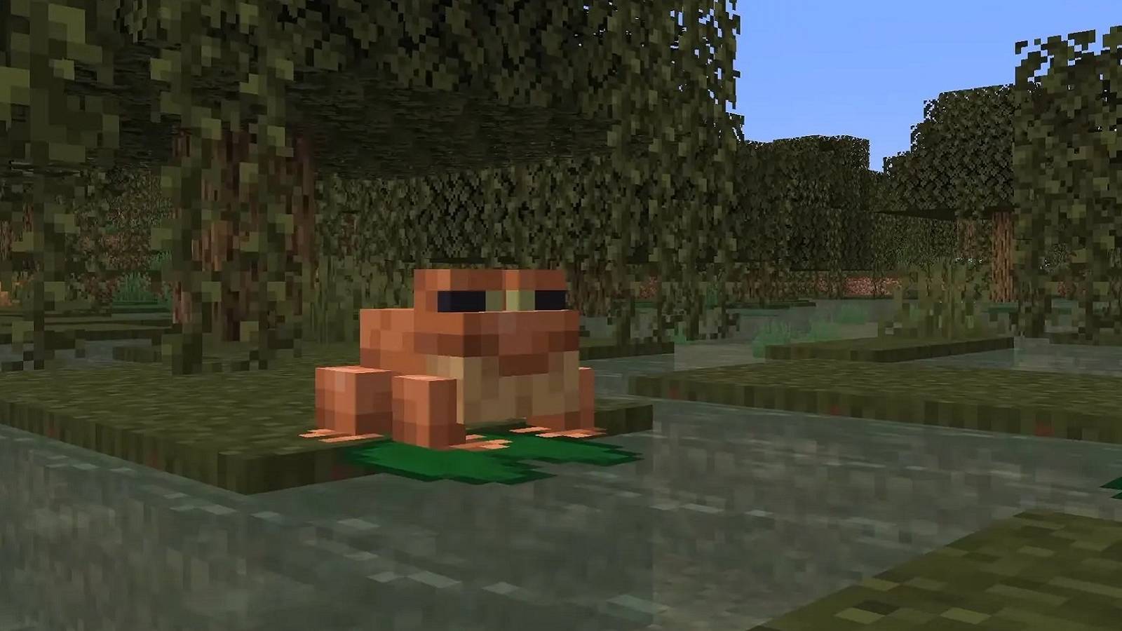 Screenshot from Minecraft showing a frog on a lily pad.