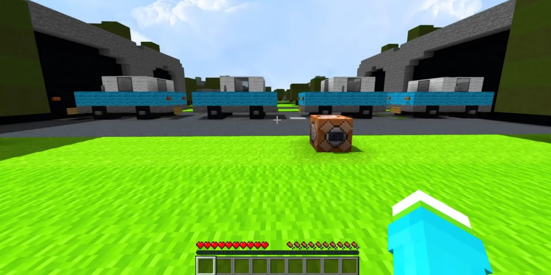 Image from a Minecraft video showing a series of cars moving along a road.