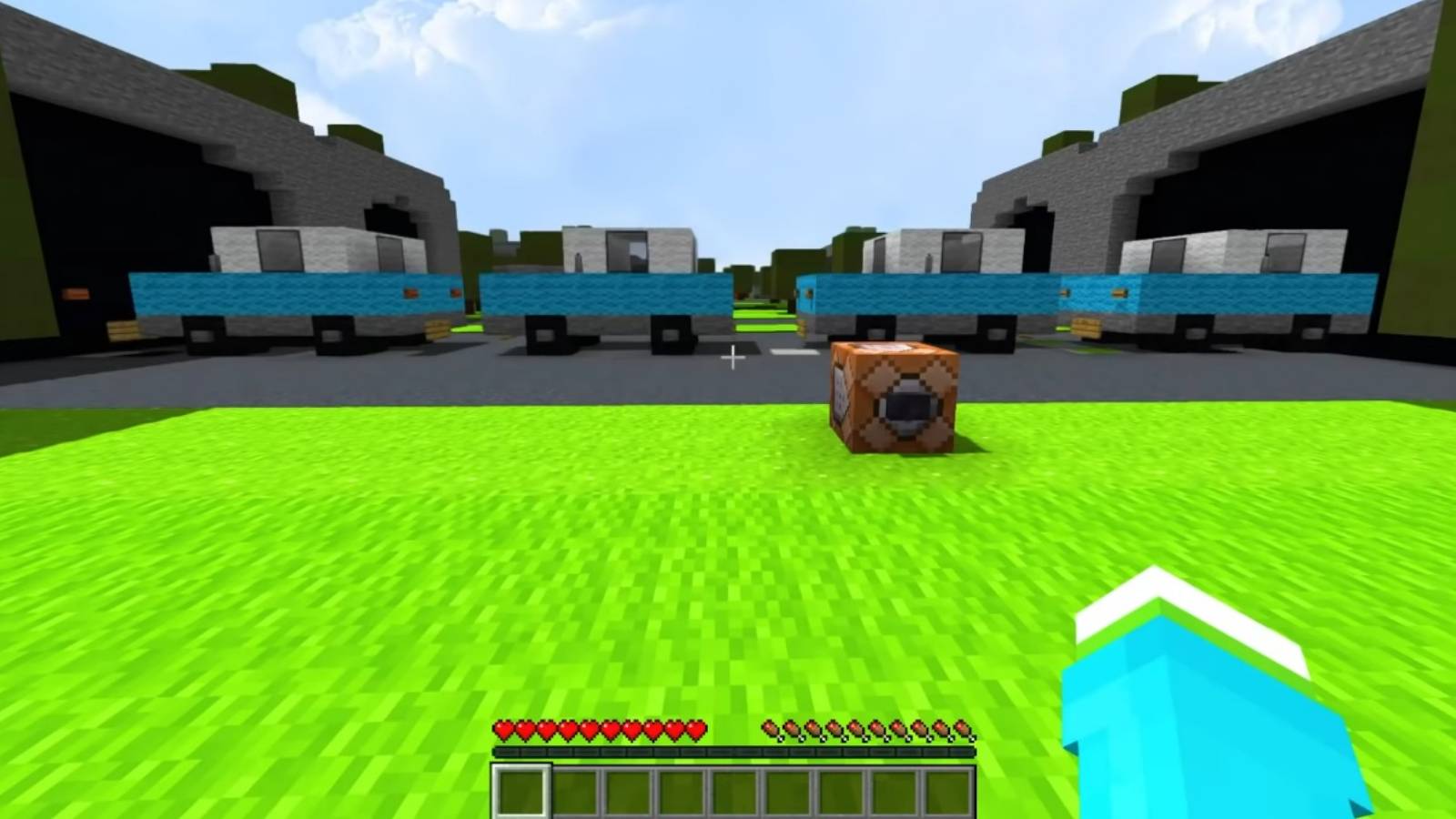 Image from a Minecraft video showing a series of cars moving along a road.
