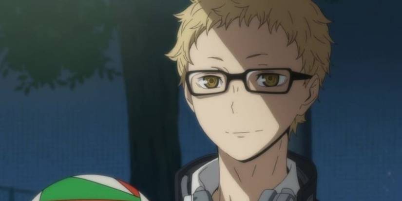 tsukishima holding a volleyball
