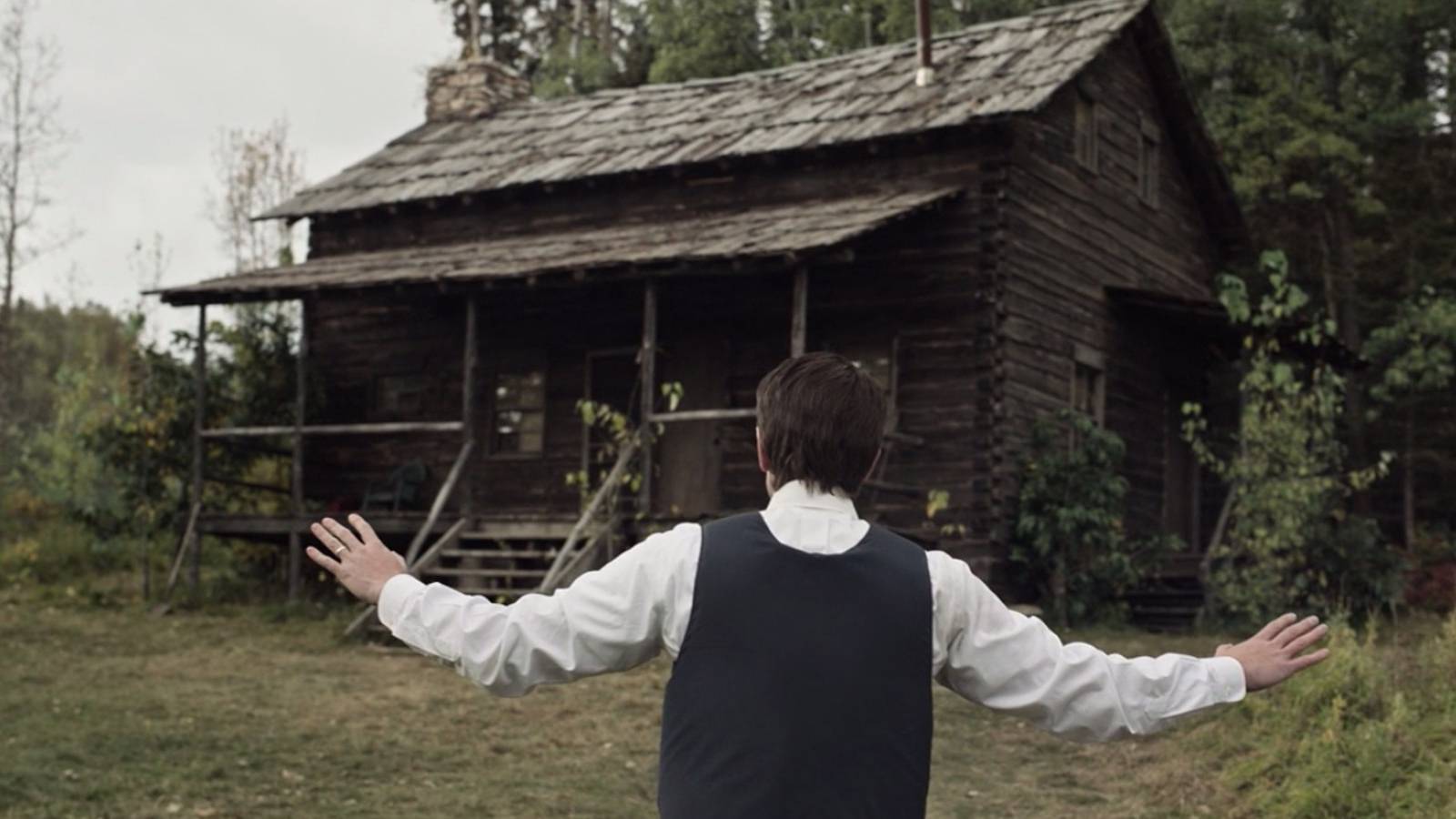 Detective Jeb Pyre approaches Sam's cabin