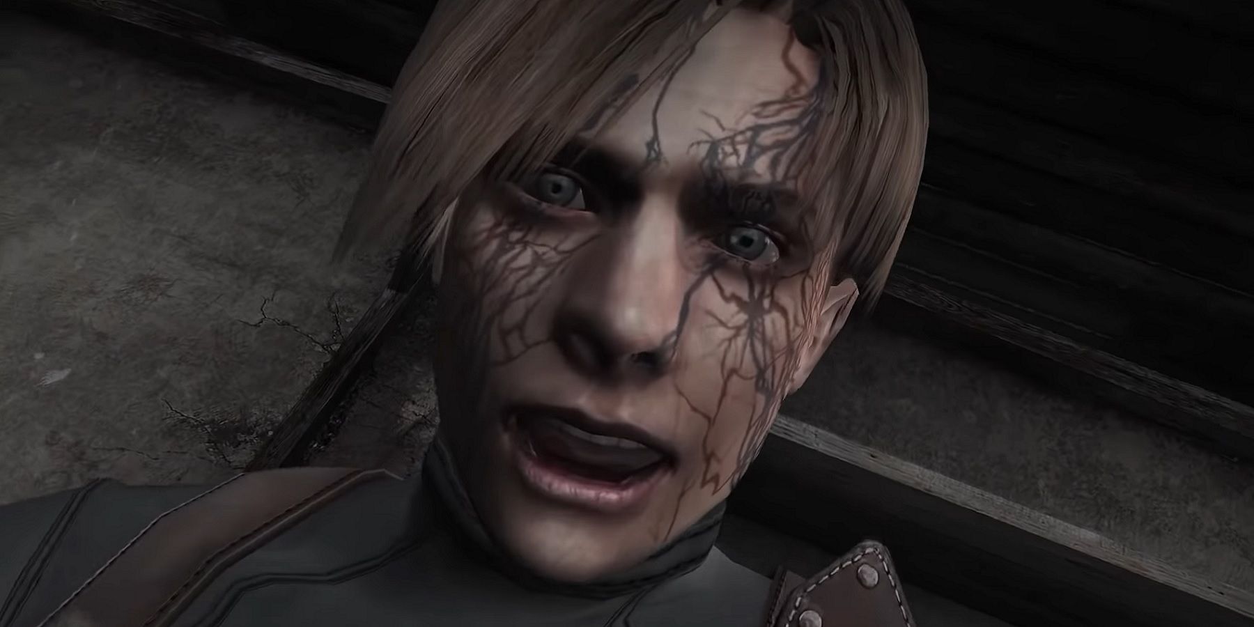 Image from Resident Evil 4 showing a close-up of Leon's infected face.