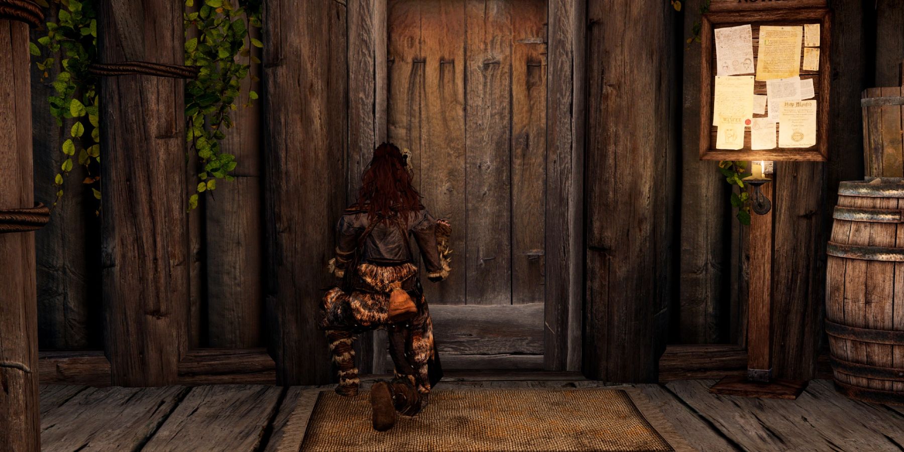 Image from The Elder Scrolls 5: Skyrim showing the player crouching in front of a door.