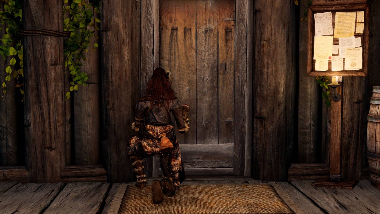 Image from The Elder Scrolls 5: Skyrim showing the player crouching in front of a door.