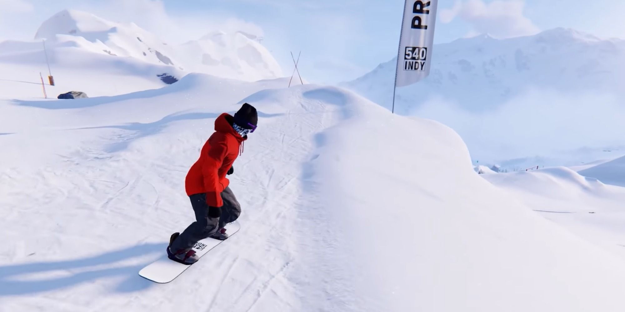 snowboarder lining up to do a big jump in shredders