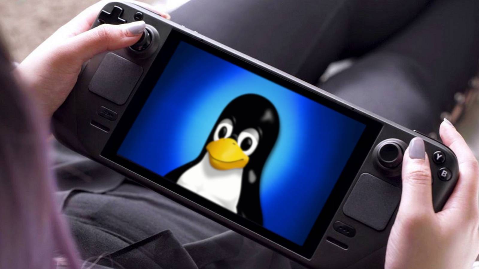 A photo of someone holding a Steam Deck which has the Linux penguin on the screen.