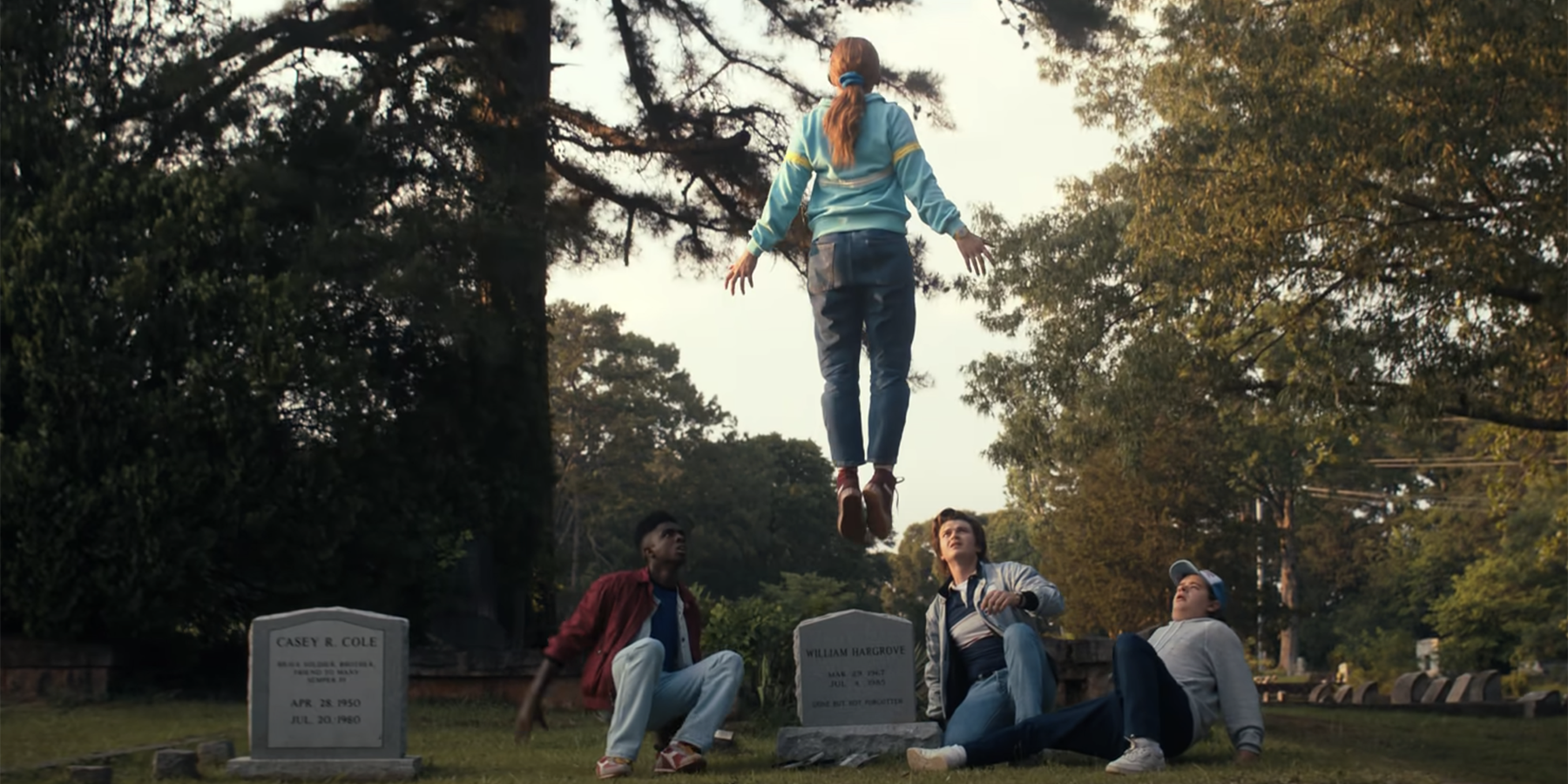 Max floating above the boys in the cemetery in Stranger Things Season 4