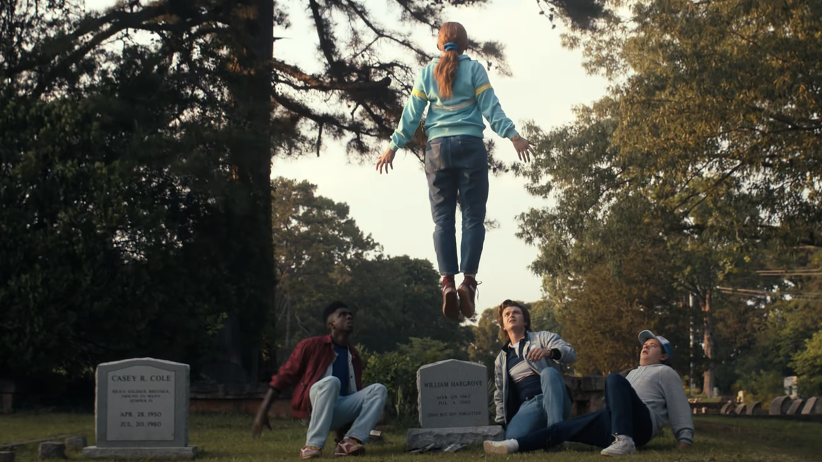 Max floating above the boys in the cemetery in Stranger Things Season 4