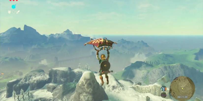 Link flying across Hyrule with the Paraglider in BOTW