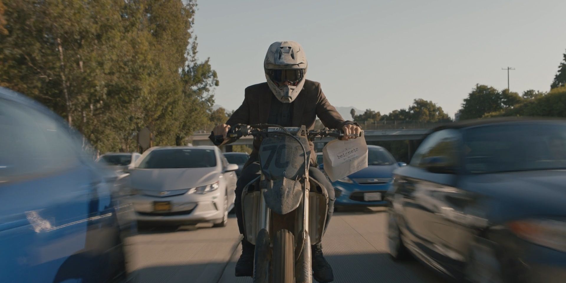 Barry Berkman on the back of a dirt bike in Barry