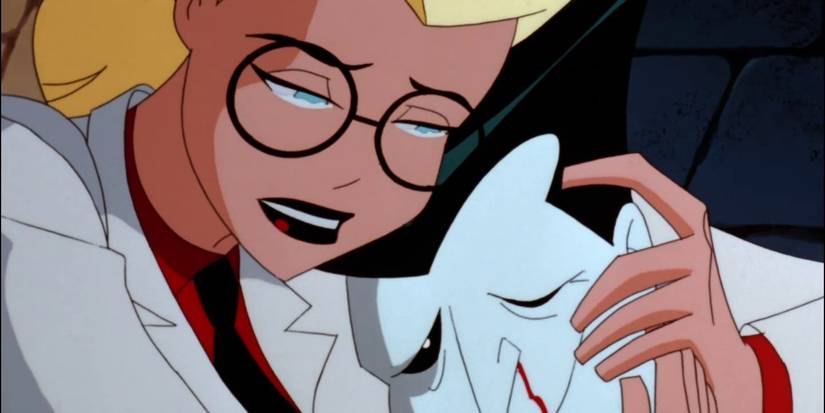 harleen quinzel holds a beaten joker