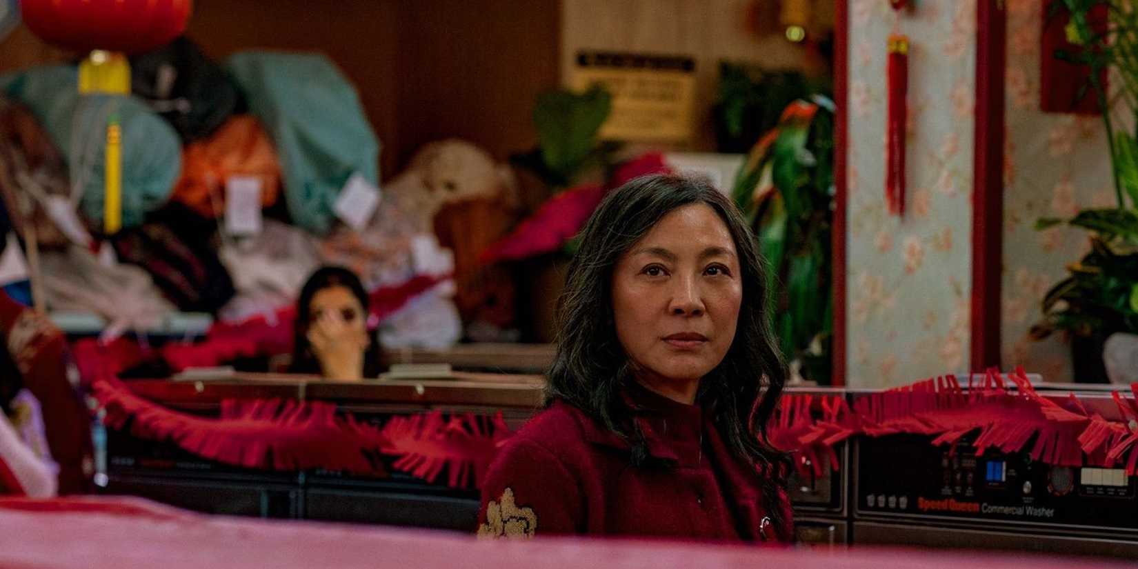 Michelle Yeoh sits in Everything Everywhere All At Once 