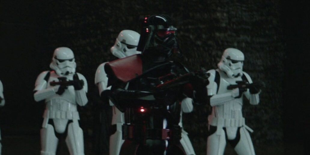 purge trooper standing next to other storm troopers 