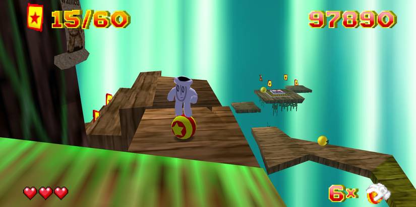 Glover standing on a ball on a stage in Glover