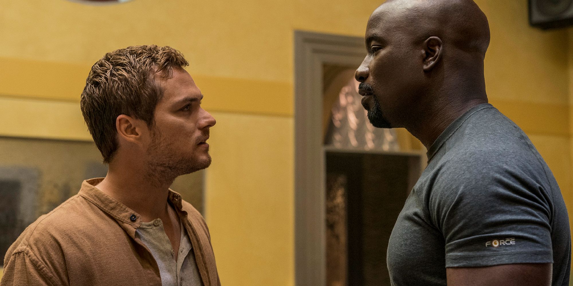 Danny Rand facing Luke Cage in the Defenders series