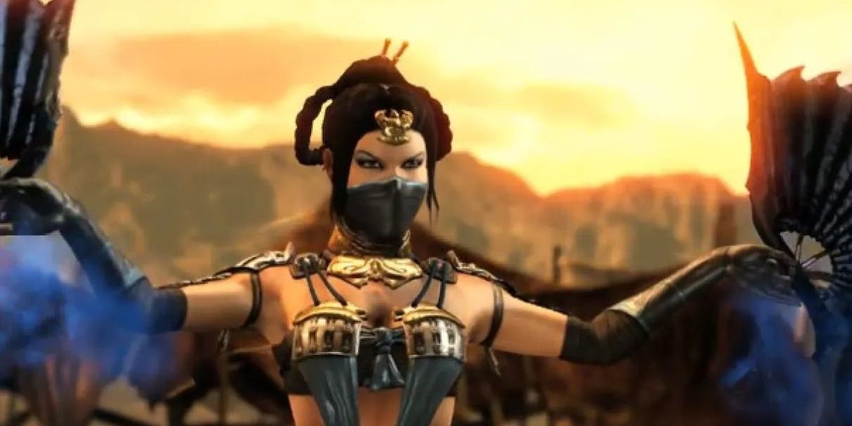 Kitana glaring towards the camera holding her war fans out in Mortal Kombat