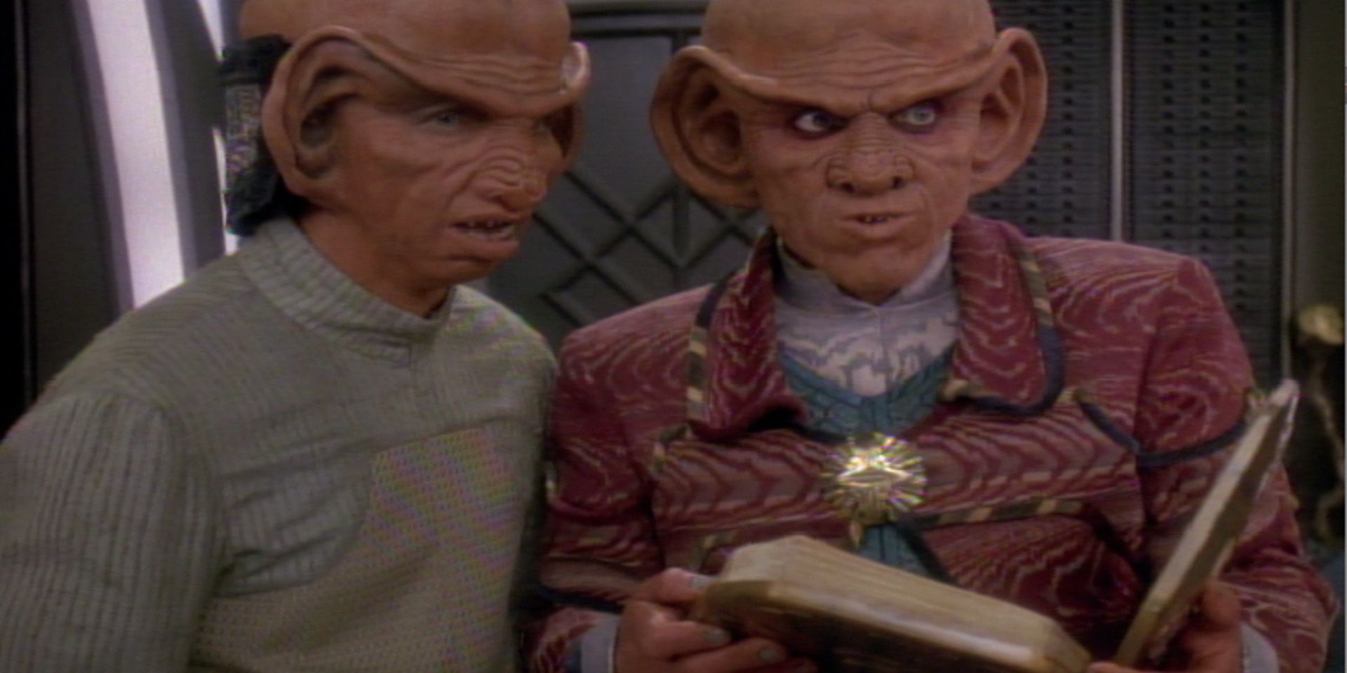 Rom (Max Grodénchik) (left) and Quark (Armin Shimerman) reading from the revised Rules of Acquisition. Image Source: ParamountPlus.com