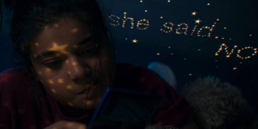 Kamala texting Bruno with stars above her bed reading "She said... no"