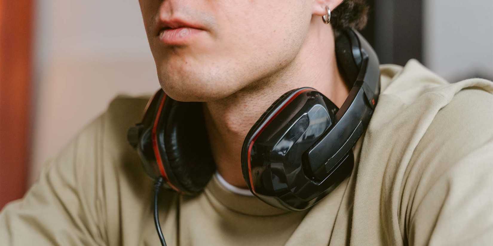 Man With Headphones On Neck