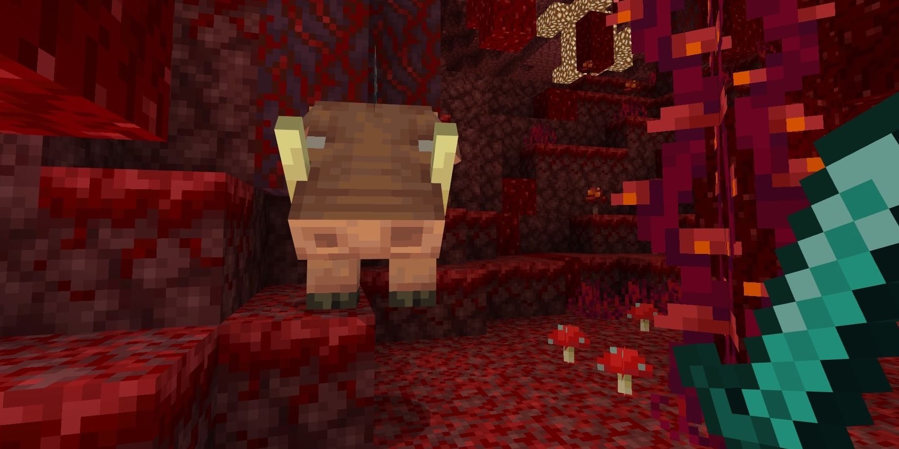 The Minecraft mob the Hoglin facing the player in the Nether