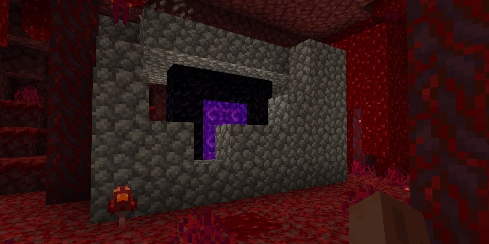 A nether portal surrounded by cobblestone in Minecraft