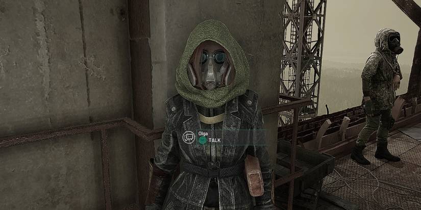 Olga facing the player with Oliver in the background from Chernobylite