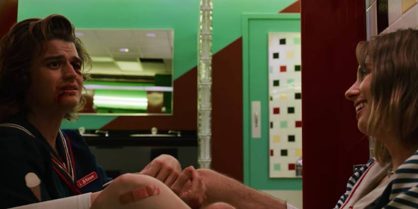 Steve and Robin talking in the bathroom of Starcourt Mall in season 3