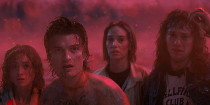 Nancy, shirtless Steve, Robin, and Eddie grouped together in the Upside-Down in season 4