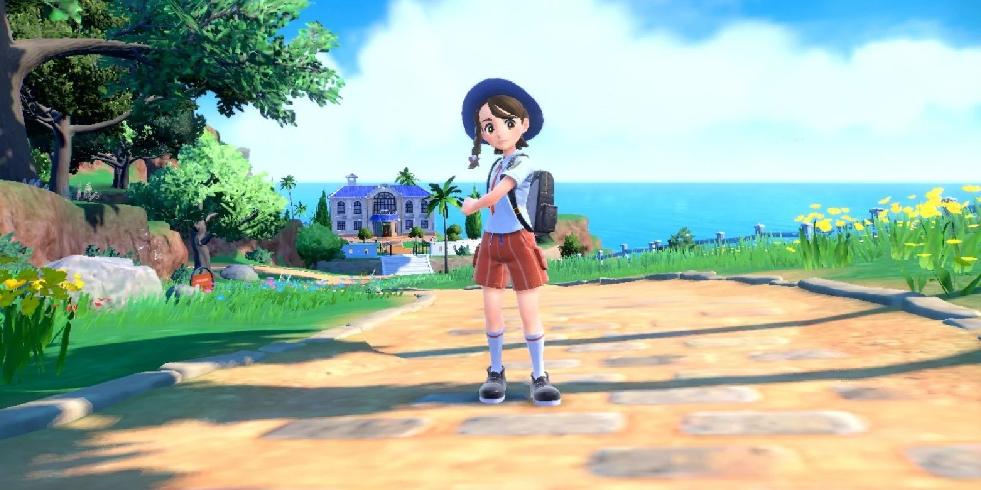 A female Trainer standing in a road in Scarlet & Violet