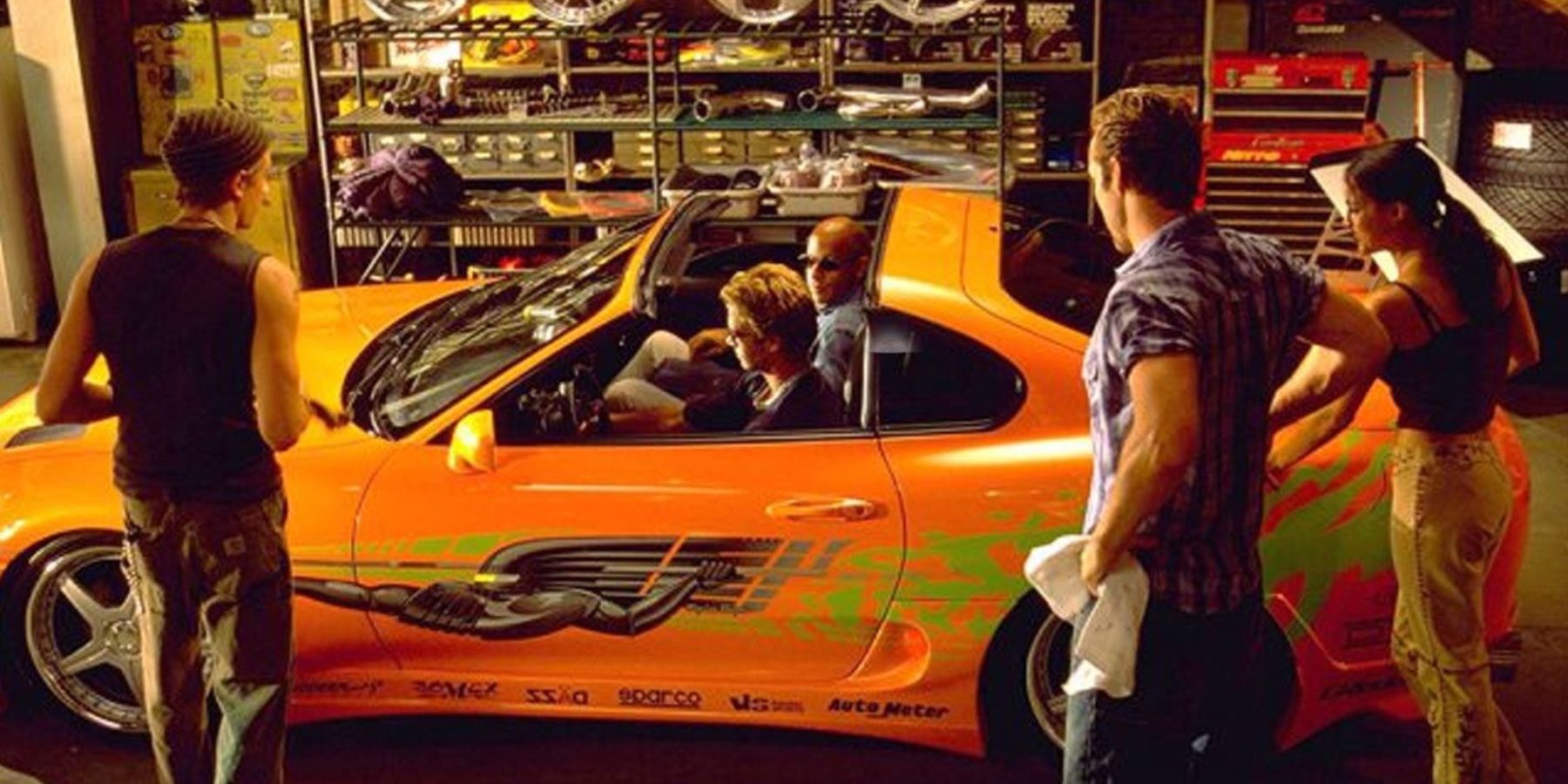 The-Fast-and-the-Furious-Jesse-Brian-Dom-Leon-and-Letty-in-a-car-garage