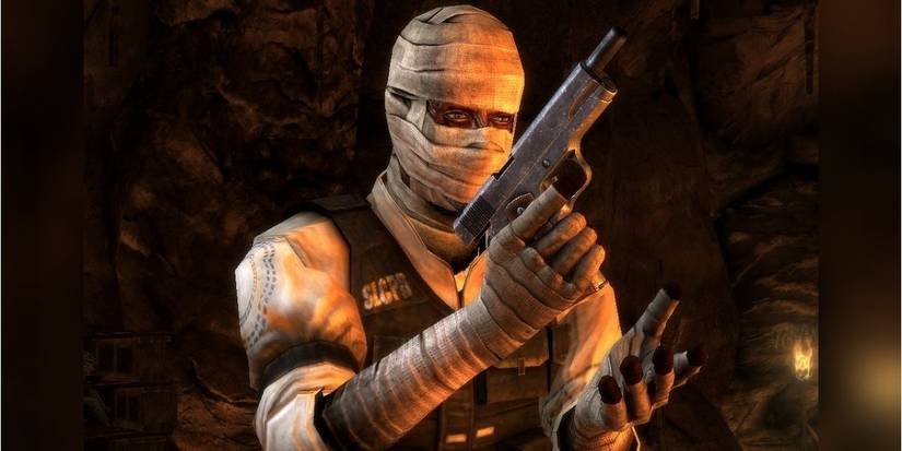 joshua graham tinkering with a pistol