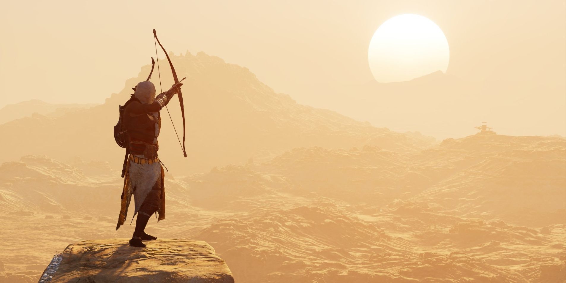 AC Origins aiming bow in the distant desert
