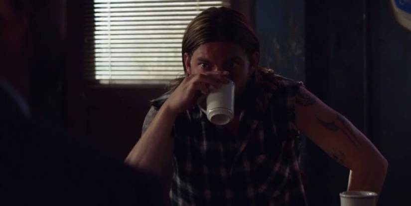 Deran Cody (Jake Weary) drinks from coffee mug