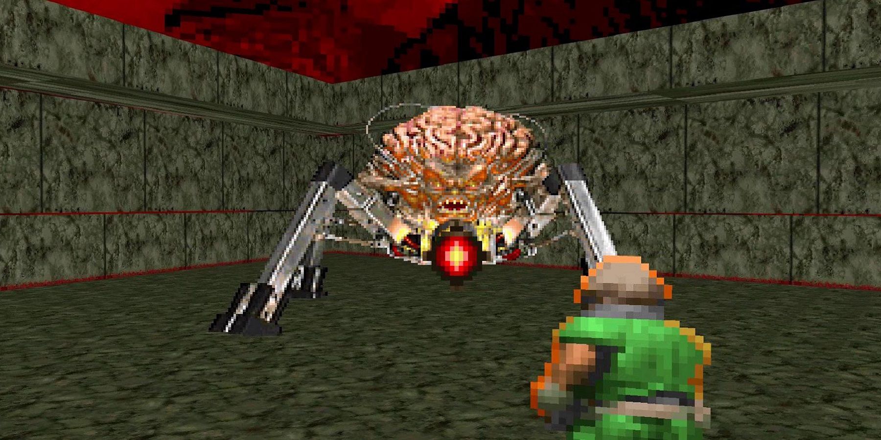 Screenshot from Doom showing the Doomguy fighting the Spider Mastermind.