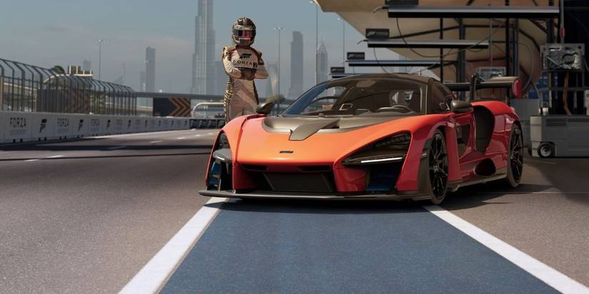 forza motorsport 7 player infront of their car 