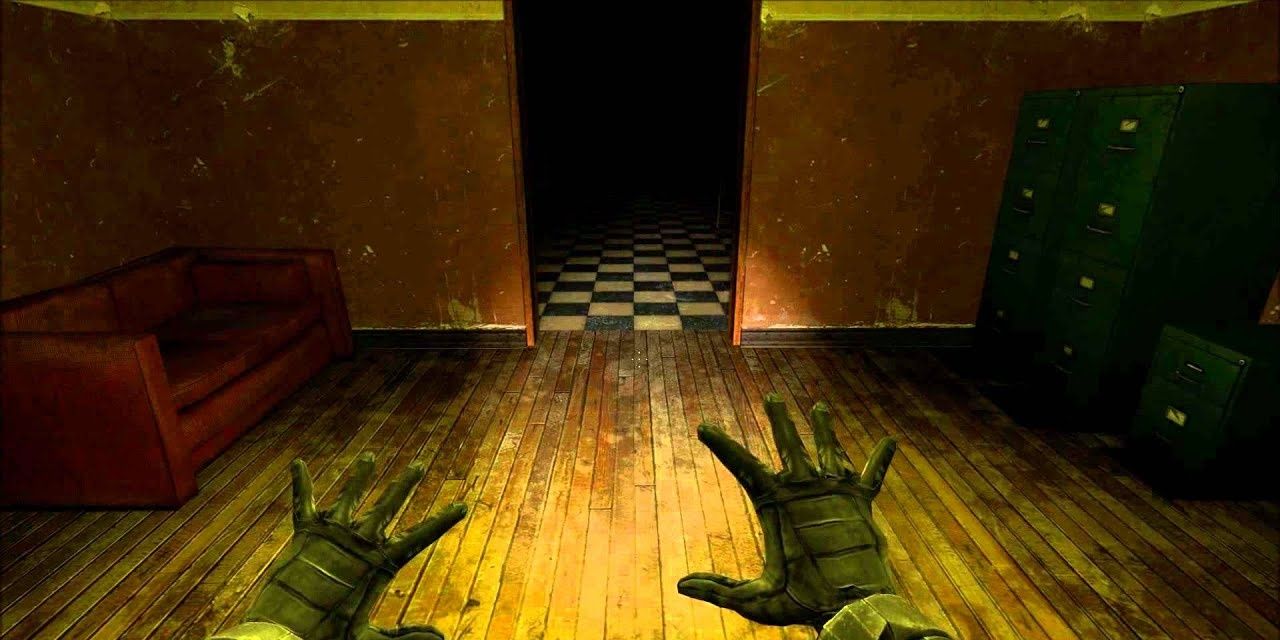 Screenshot from Half-Life 2 with players hands and dark hallway