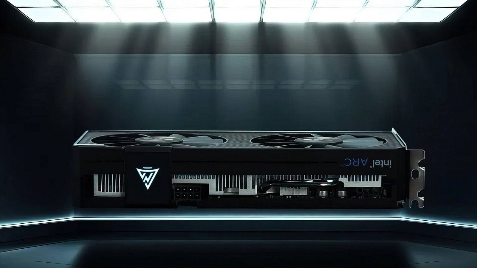 Image of an Intel Arc graphics card floating with a light shining down on it.